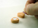 3. Apply transfer face-down to clay