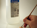 4. Brush rubbing alcohol onto transfer