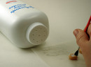 5. Tap baby powder onto transfer